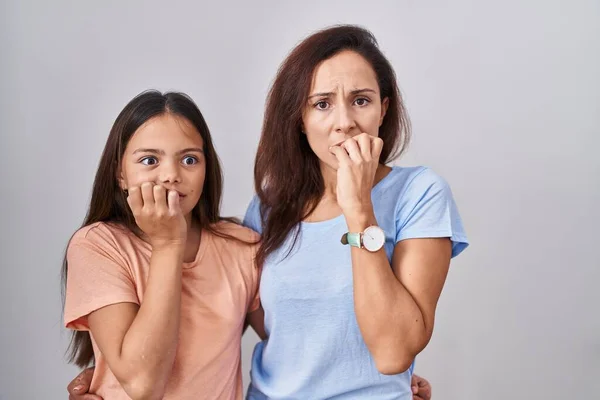 Young Mother Daughter Standing White Background Looking Stressed Nervous Hands — Stock Photo, Image