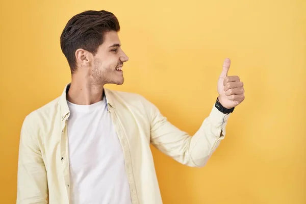 Young Hispanic Man Standing Yellow Background Looking Proud Smiling Doing — Stockfoto