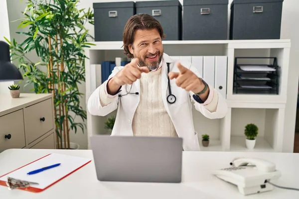 Handsome Middle Age Doctor Man Working Clinic Pointing Fingers Camera — Stock Photo, Image