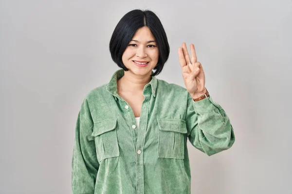 Young Asian Woman Standing White Background Showing Pointing Fingers Number — Stok fotoğraf