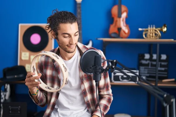 Young Hispanic Man Musician Singing Song Playing Tambourine Music Studio — Stock Photo, Image