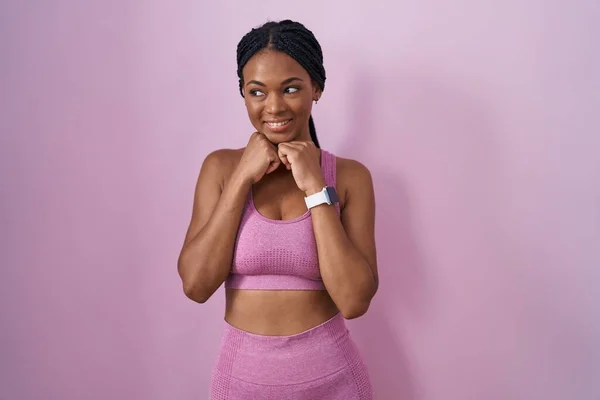 African American Woman Braids Wearing Sportswear Pink Background Laughing Nervous — Stockfoto