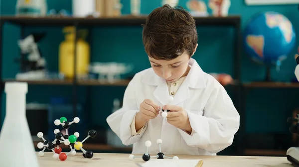 Adorable Hispanic Boy Student Holding Molecules Toy Laboratory Classroom — 图库照片