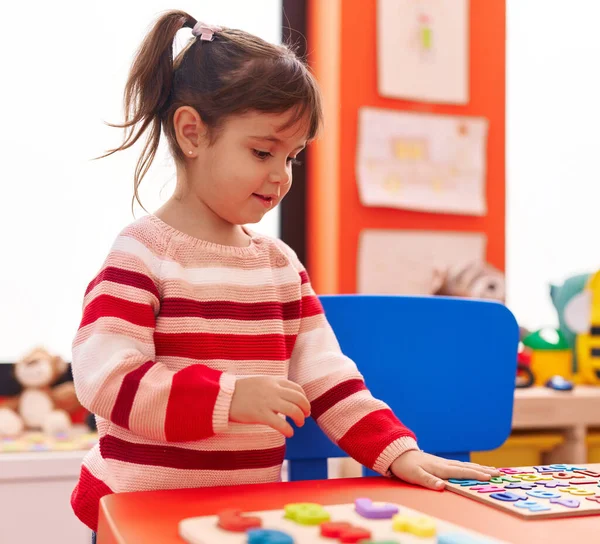 Adorable Hispanic Girl Playing Maths Puzzle Game Standing Kindergarten — Fotografia de Stock