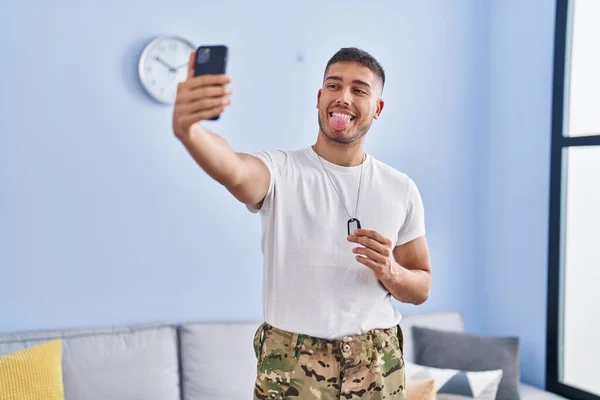 Young Hispanic Man Wearing Camouflage Army Uniform Taking Selfie Home — Stock Photo, Image
