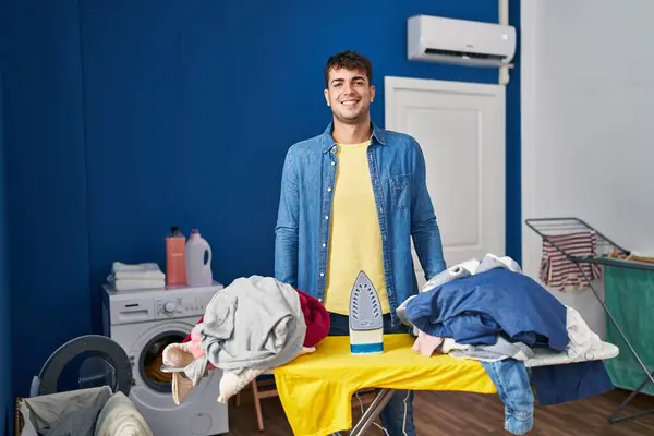 Young Hispanic Man Ironing Clothes Home Happy Cool Smile Face — Stock Photo, Image