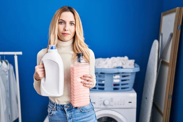 Young Caucasian Doctor Woman Holding Detergent Bottle Laundry Room Relaxed — Stock Photo, Image
