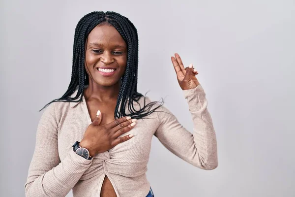 African Woman Braids Standing White Background Smiling Swearing Hand Chest — Stockfoto