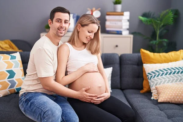 Man Woman Couple Touching Belly Sitting Sofa Home — Stock Photo, Image