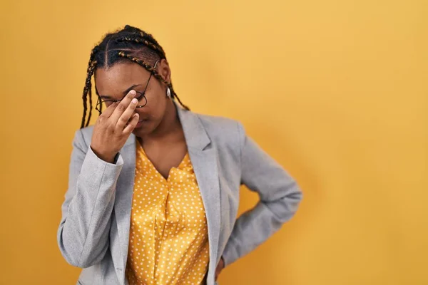 African American Woman Braids Standing Yellow Background Tired Rubbing Nose —  Fotos de Stock