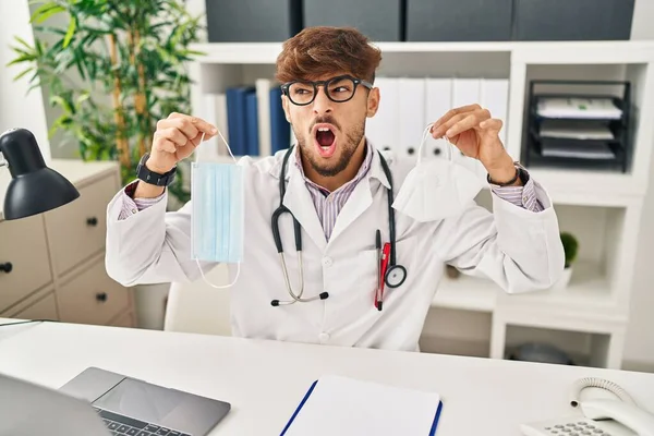 Arab Man Beard Wearing Doctor Uniform Holding Medical Mask Angry — Stockfoto