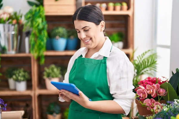 Young Beautiful Hispanic Woman Florist Smiling Confident Using Touchpad Flower — Stock Photo, Image