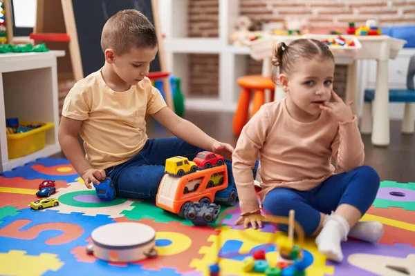 Two Kids Playing Cars Toy Sitting Floor Kindergarten — Zdjęcie stockowe