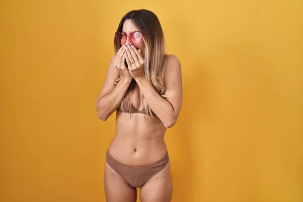 Young Hispanic Woman Wearing Bikini Yellow Background Laughing Embarrassed Giggle — Stock Photo, Image