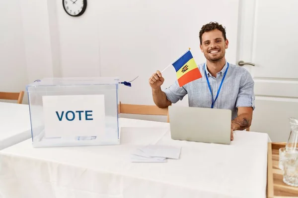 Young Hispanic Man Smiling Confident Holding Moldova Flag Working Electoral — Stock Photo, Image