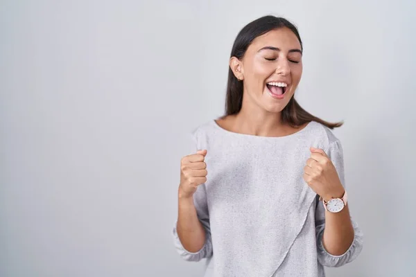 Young Hispanic Woman Standing White Background Very Happy Excited Doing — Zdjęcie stockowe