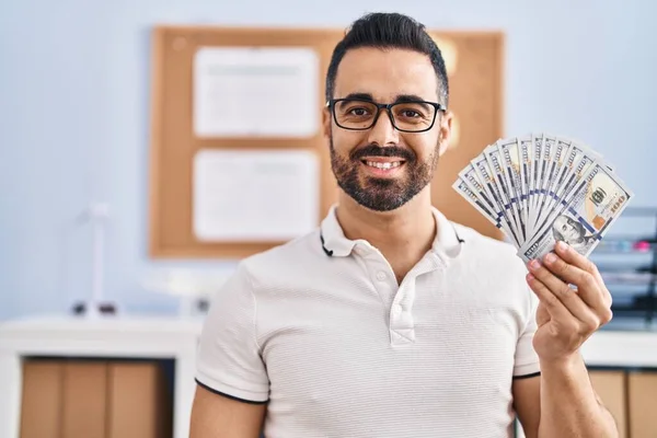 Young Hispanic Man Beard Glasses Holding Dollar Banknotes Looking Positive — Stock Photo, Image