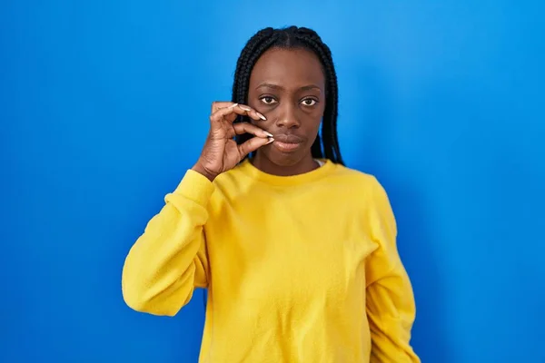 Beautiful Black Woman Standing Blue Background Mouth Lips Shut Zip — Zdjęcie stockowe
