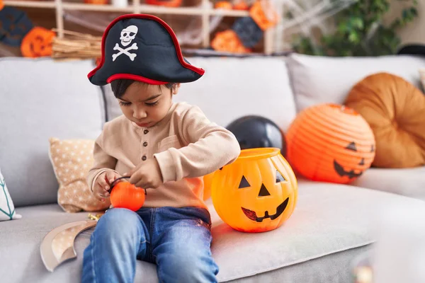 Adorable Hispanic Boy Having Halloween Party Holding Pumpkin Basket Home — Zdjęcie stockowe