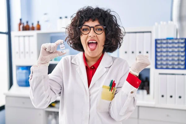 Hispanic Doctor Woman Curly Hair Holding Vaccine Screaming Proud Celebrating — Foto Stock
