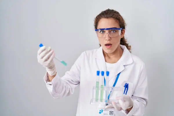 Young Caucasian Scientist Woman Working Laboratory Samples Shock Face Looking — Stockfoto