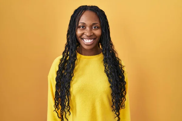 African Woman Standing Yellow Background Happy Cool Smile Face Lucky — Stockfoto