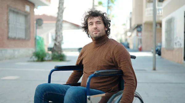 Young Hispanic Man Sitting Wheelchair Relaxed Expression Street — Stok fotoğraf