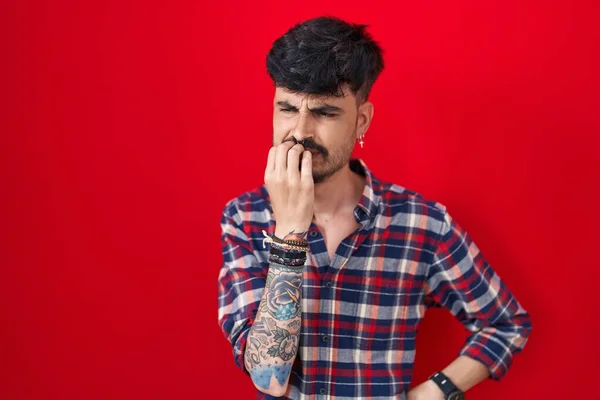 Young Hispanic Man Beard Standing Red Background Looking Stressed Nervous — ストック写真