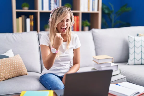 Young Blonde Woman Studying Using Computer Laptop Home Angry Mad — Stockfoto