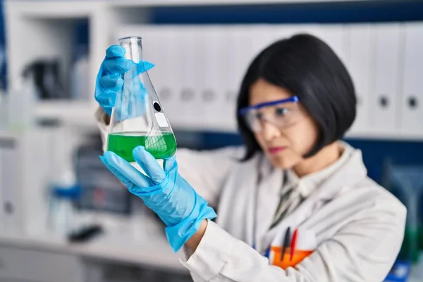 Young Chinese Woman Scientist Holding Measuring Liquid Laboratory —  Fotos de Stock