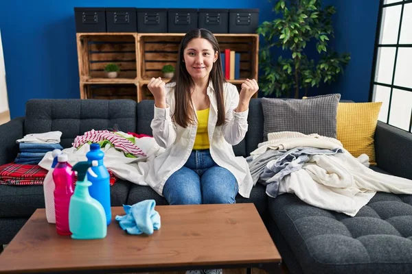 Young Latin Woman Doing Laundry Home Screaming Proud Celebrating Victory — Stockfoto