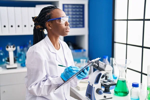 African American Woman Scientist Writing Document Laboratory — Fotografia de Stock