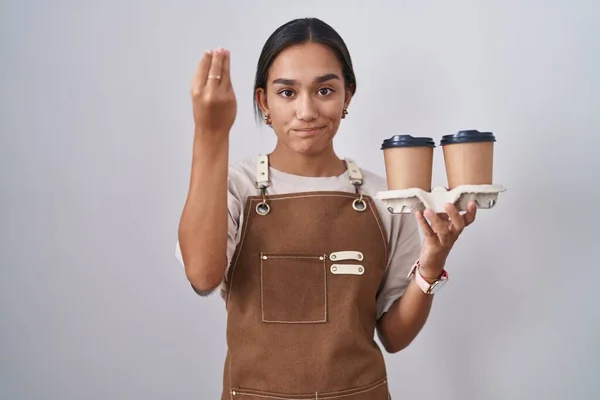 Young Hispanic Woman Wearing Professional Waitress Apron Holding Coffee Doing — Zdjęcie stockowe