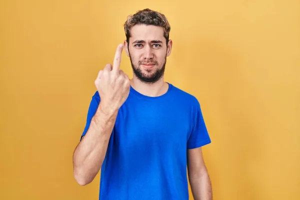 Hispanic Man Beard Standing Yellow Background Showing Middle Finger Impolite — Stockfoto