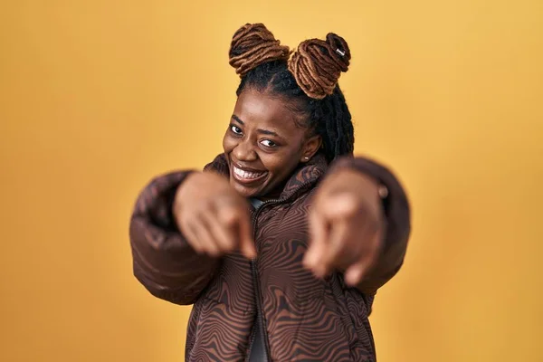 African Woman Braided Hair Standing Yellow Background Pointing You Camera — ストック写真