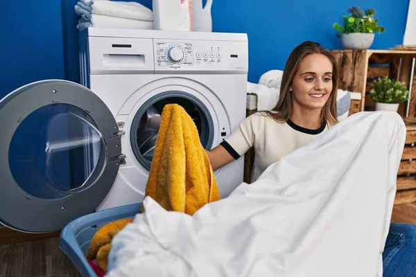 Young Blonde Woman Smiling Confident Holding Clean Clothes Laundry Room — Stockfoto