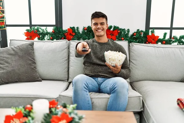 Young Hispanic Man Watching Sitting Sofa Christmas Decor Home — Photo