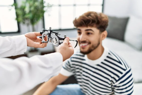 Young Arab Man Smiling Confident Reciving Optometrist Glasses Home — Stockfoto