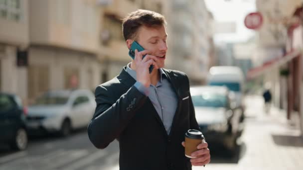 Young Caucasian Man Talking Smartphone Drinking Coffee Street — Stockvideo