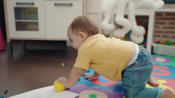 Adorable Hispanic Baby Playing Balls Crawling Floor Kindergarten — Wideo stockowe