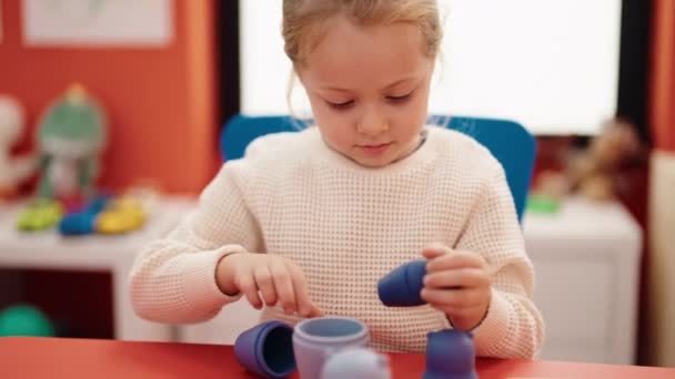 Adorable Blonde Girl Playing Toys Sitting Table Kindergarten — Wideo stockowe