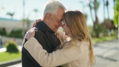 Middle age couple couple smiling confident dancing at park