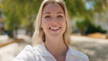 portrait of beautiful young woman having video call