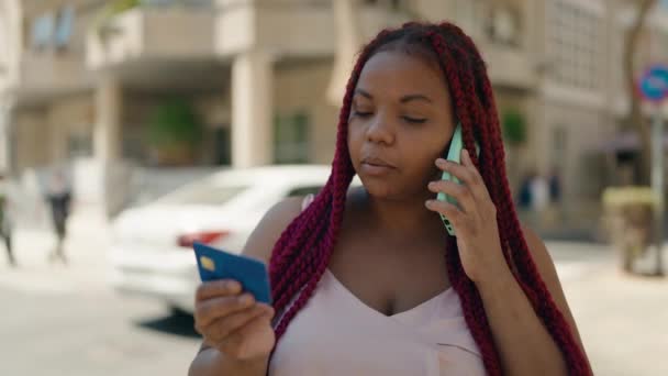 African American Woman Talking Smartphone Using Credit Card Street — Stockvideo