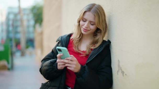 Young Blonde Girl Smiling Confident Using Smartphone Street — Stockvideo