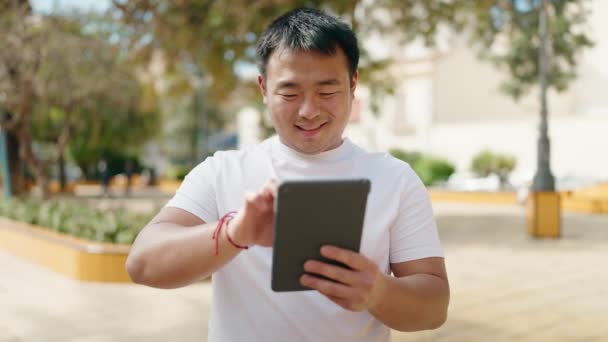 Young Chinese Man Smiling Confident Using Touchpad Park — Wideo stockowe