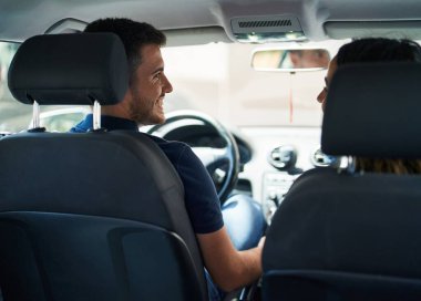 Young hispanic couple smiling confident driving car at street