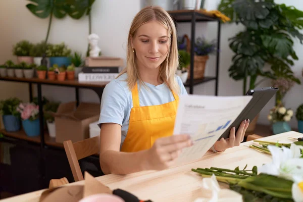 Young Blonde Woman Florist Using Touchpad Reading Document Flower Shop — Stockfoto