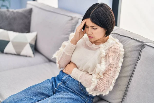 Young Chinese Woman Stressed Sitting Sofa Home — Foto de Stock