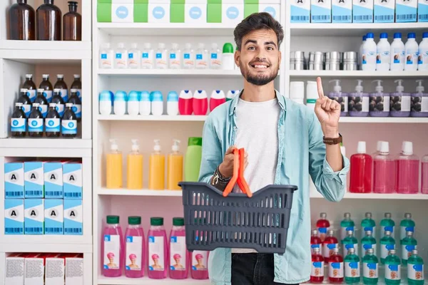 Young Hispanic Man Tattoos Shopping Pharmacy Drugstore Holding Basket Smiling — Stockfoto